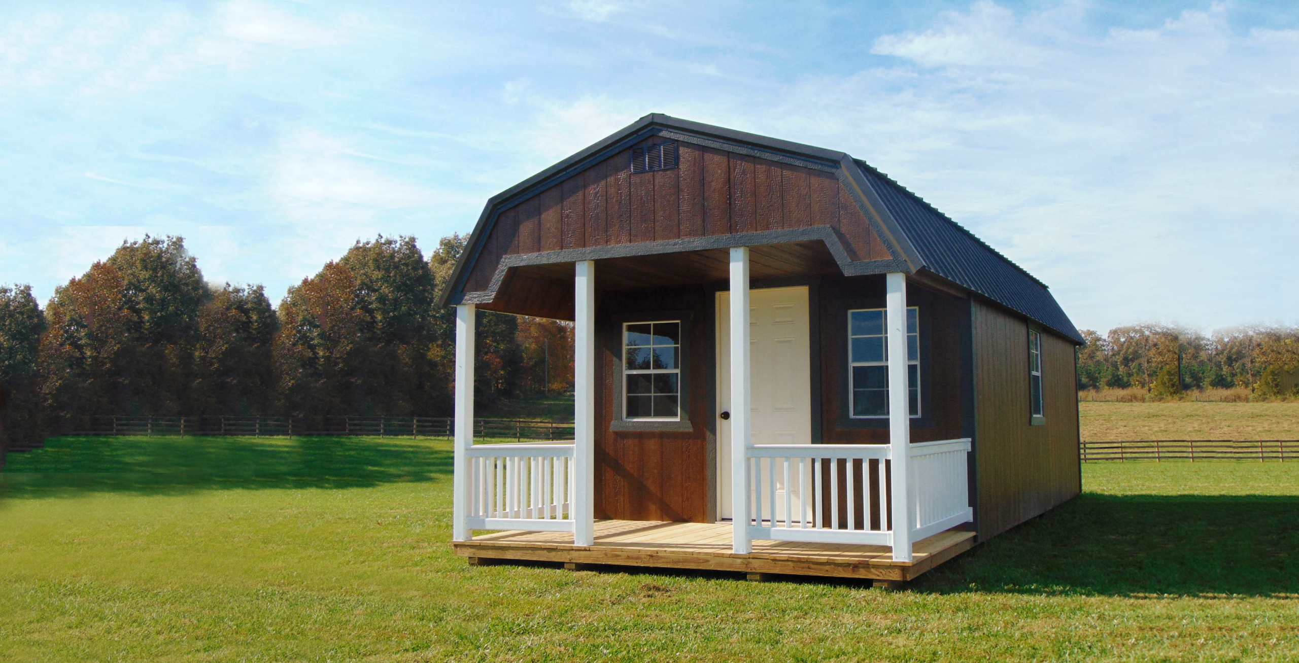 Brown lofted cabin in a yard from JCM Rentals located in Ina, Illinois